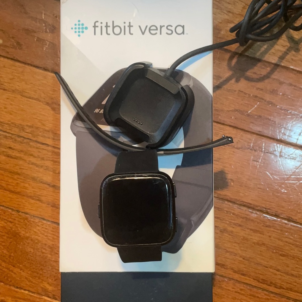 Fitbit Versa with charging cord